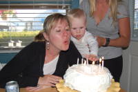 dsc_1201.jpg Devin helps blow out the candles on Mama's birthday