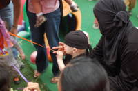 dsc_3652.jpg Devin pulls on the strings of the Pinata