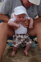 dsc_5581.jpg Devin sticks his feet in the sand for the first time