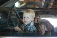 dsc_1300.jpg Devin got in mama's new Porsche, and crawled right into the driver's seat.