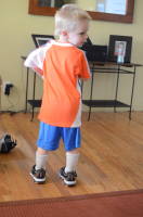 dsc_6414.jpg Grant tries out his new soccer jersey, and first says "Take a picture of my butt!"